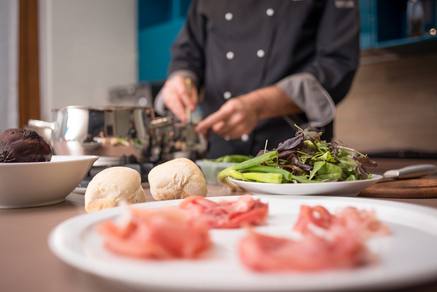 Professional chef preparing meal in private house: Stir tomato soup